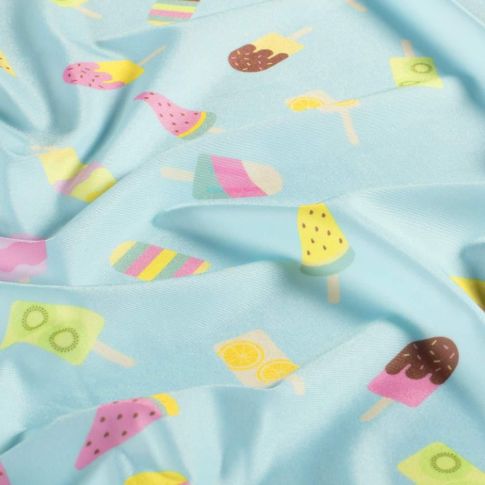 Tissu Lycra glaces Fizzy multicolores sur fond Bleu pastel