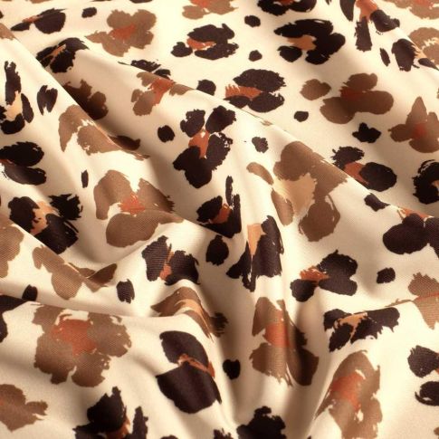 Tissu Lycra taches léopard Liora fauves sur fond Beige
