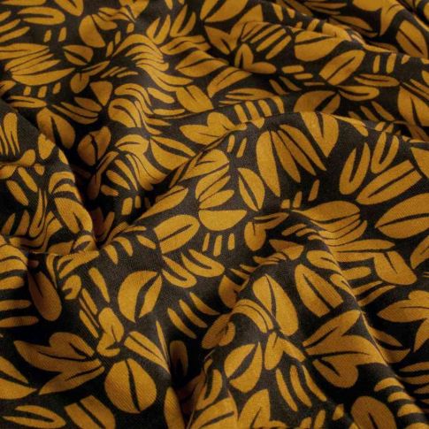 Tissu Sweat léger French Terry Emily feuillages stylisés Moutarde sur fond Noir