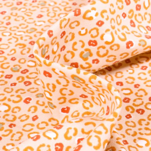 Tissu Jersey Coton Arty Cougui sur fond Saumon