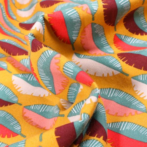 Tissu Viscose Feuilles multicolores sur fond Jaune