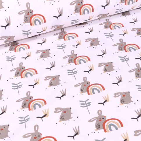 Tissu Jersey coton Lapins et arc en ciel sur fond Blanc