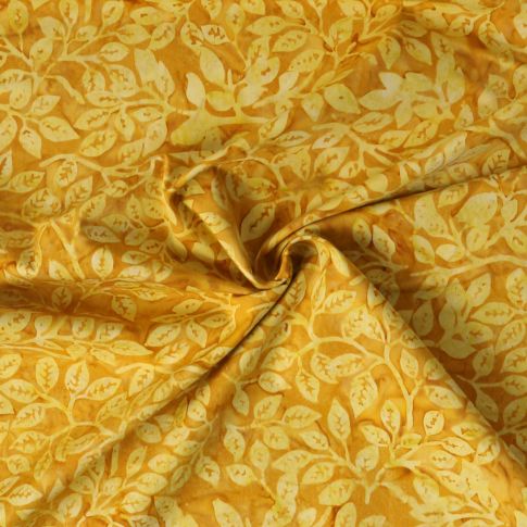 Tissu Coton imprimé Batik Sunleaf sur fond Jaune or