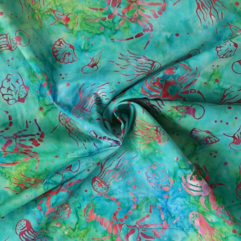 Tissu Coton imprimé Batik Aquaflow sur fond Vert émeraude