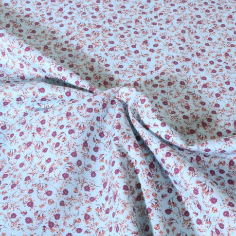 Tissu Popeline de Coton légère Motif floral sur fond Bleu ciel