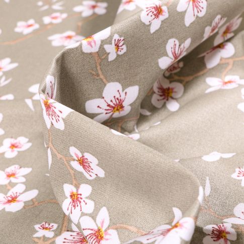 Tissu Coton enduit Fleur d'amandier sur fond Taupe