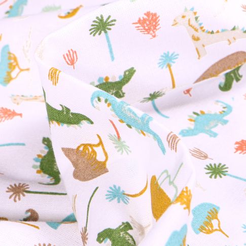 Tissu Coton imprimé Arty Dino colorés sur fond Blanc