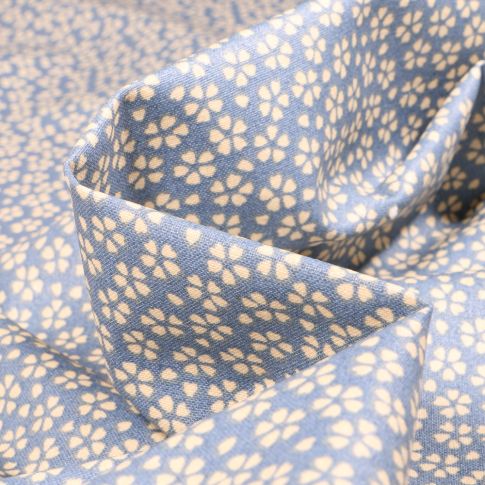 Tissu Coton enduit Myosotis sur fond Bleu clair