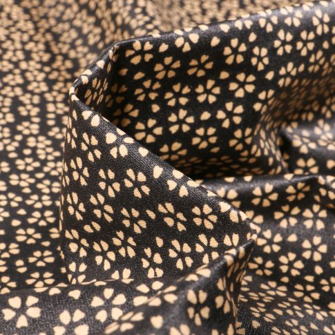 Tissu Coton enduit Myosotis sur fond Noir