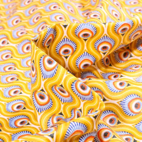 Tissu Coton enduit Feuilles de Paon sur fond Jaune