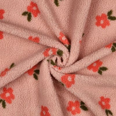 Tissu Bouclette imprimé Fleuris sur fond Saumon - Par 10 cm