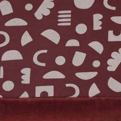 Tissu Sweat envers minky motifs géo sur fond Bordeaux - Par 10 cm