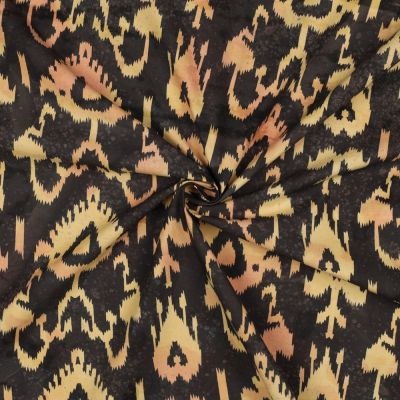 Tissu Batik de Coton motif ethnique Beige doré sur fond Noir profond - Par 10 cm
