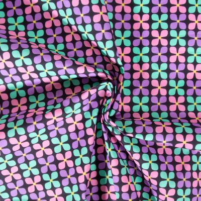 Tissu Coton enduit Poppy Fleur menthe et mauve sur fond Noir - Par 10 cm