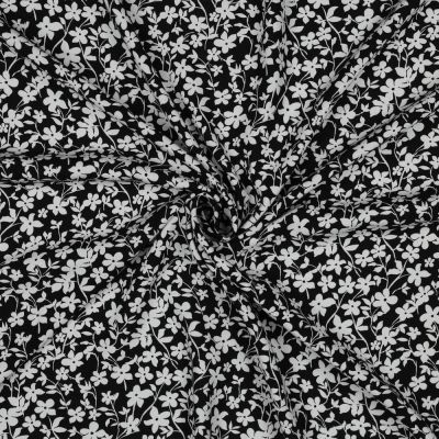Tissu Viscose imprimé Petites fleurs Blanche sur fond Noir - Par 10 cm