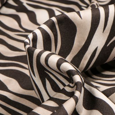 Tissu Softshell Zébré sur fond Beige - Par 10 cm