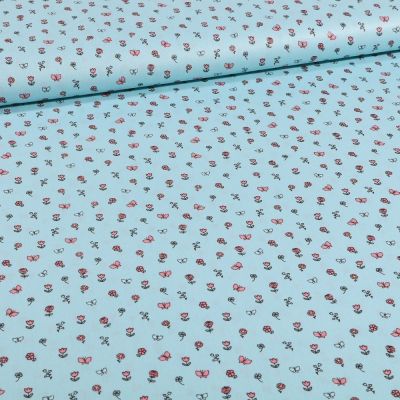 Tissu Coton imprimé Petits bouquets de fleurs et papillons sur fond Bleu - Par 10 cm
