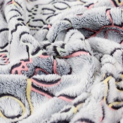 Tissu Doudou têtes de mort sur fond Gris - Par 10 cm