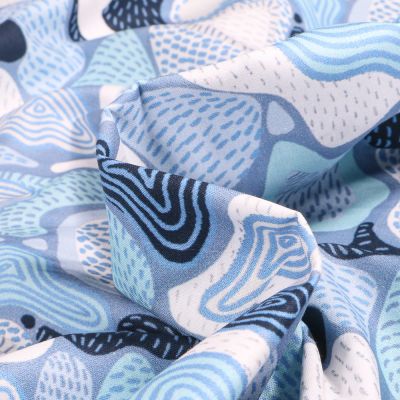 Tissu Coton imprimé Frou-Frou Fodere sur fond Bleu ciel - Par 10 cm