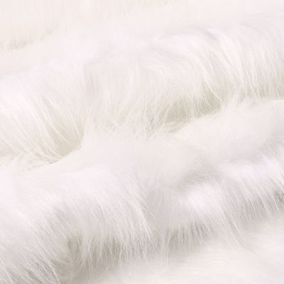 Tissu Fausse fourrure Fantasia sur fond Blanc - Par 10 cm