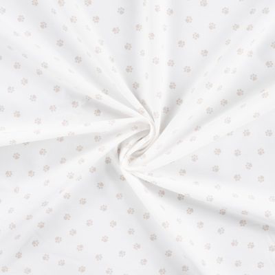 Tissu Popeline de Coton  patounes taupes Zumi sur fond Blanc cassé - Par 10 cm