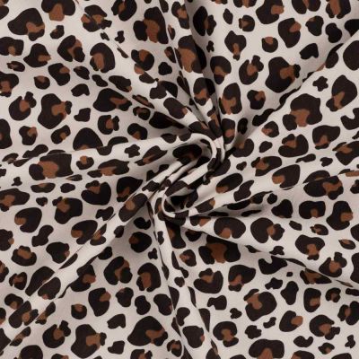 Tissu Jersey stretch Félina sur fond Beige clair - Par 10 cm