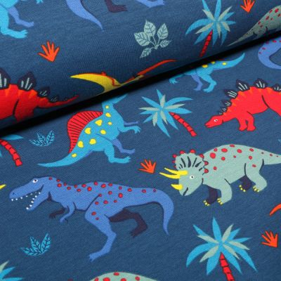 Tissu Jersey Coton French Terry Dinosaures colorés et palmiers sur fond Bleu - Par 10 cm