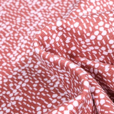 Tissu Jersey Coton Bio Pois et pointillés sur fond Terre de Sienne - Par 10 cm