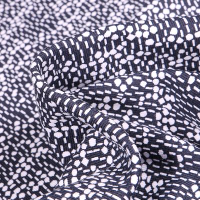 Tissu Jersey Coton Bio Pois et pointillés sur fond Bleu marine - Par 10 cm