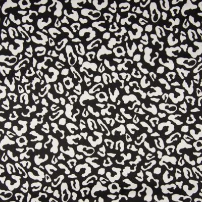 Tissu Coton satiné extensible Tâches léopard blanches sur fond Noir - Par 10 cm