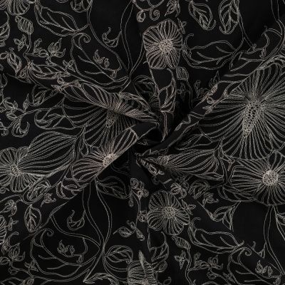 Tissu Coton brodé imprimé Fleuris sur fond Noir - Par 10 cm