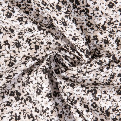 Tissu Toile Polycoton Liana fleurs Blanc et Noir sur fond Naturel - Par 10 cm