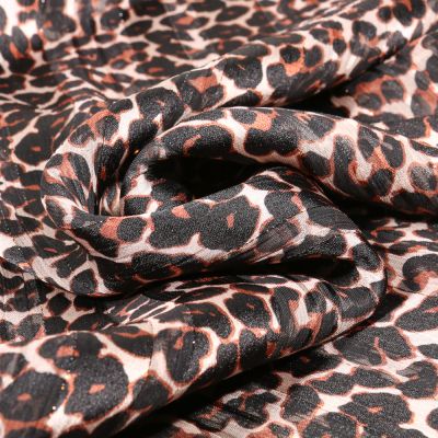 Tissu Mousseline Cheetah sur fond Ecru - Par 10 cm
