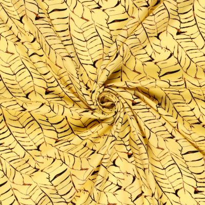 Tissu Popeline de Viscose imprimé Feuilles noires sur fond Jaune - Par 10 cm