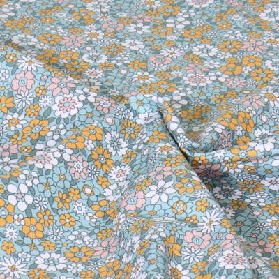 Tissu Popeline de Coton Petites fleurs jaunes, roses et blanches sur fond Bleu pétrole - Par 10 cm