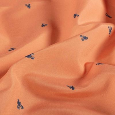 Tissu Short de Bain homards Cayana bleus sur fond Orange - Par 10 cm