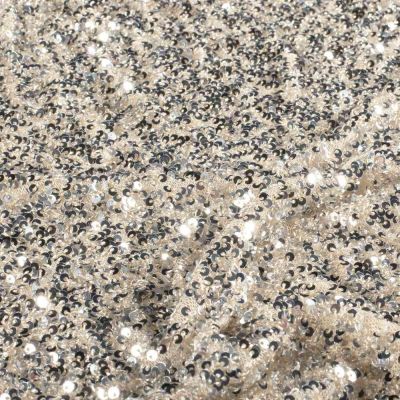 Tissu Sequins Cosmos sequins Argentés sur fond Beige nacré - Par 10 cm