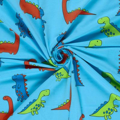 Tissu Jersey Coton imprimé Dino vert, rouge et bleu sur fond Bleu turquoise - Par 10 cm