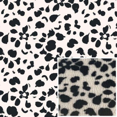 Tissu Fausse fourrure Mouton Pétales noires sur fond Ecru - Par 10 cm