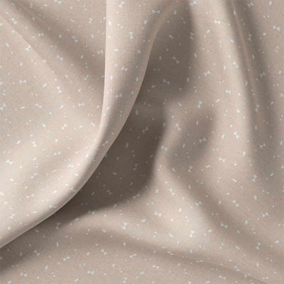Tissu Coton imprimé graphique Kido blanc sur fond Beige sable - Par 10 cm