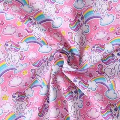 Tissu Coton imprimé  Ella licornes et arc en ciel sur fond Rose bonbon - Par 10 cm