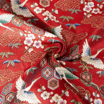 Tissu Jacquard d&#039;ameublement tissé teint Grues sur fond Rouge - Par 10 cm