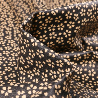 Tissu Coton enduit Myosotis sur fond Noir - Par 10 cm