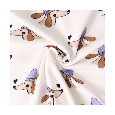 Tissu Coton imprimé Chiens et Coeurs sur fond Blanc cassé - Par 10 cm