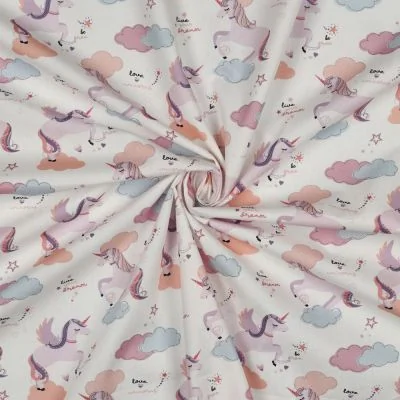 Tissu Popeline de Coton Zelhia licornes magiques sur fond Blanc cassé - Par 10 cm