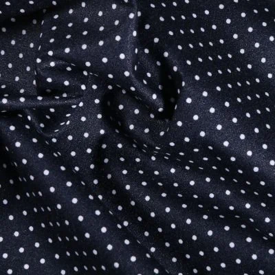 Tissu Coton enduit Petits pois blancs sur fond Bleu marine - Par 10 cm
