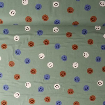 Tissu Flanelle de Coton Zoé smiley Bleu sur fond Vert olive - Par 10 cm