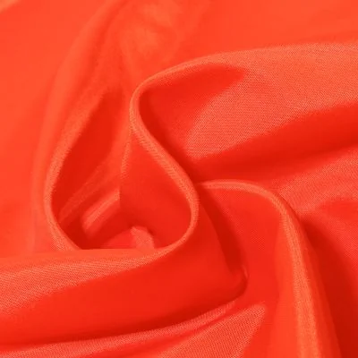 Tissu Doublure Pongé uni Orange fluo - Par 10 cm
