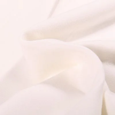 Tissu Jersey Coton Bio uni Blanc cassé - Par 10 cm