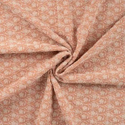 Tissu Gaze de Coton Fleurs brodées sur fond Saumon - Par 10 cm